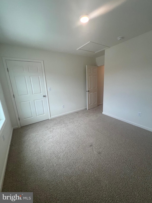 spare room featuring carpet