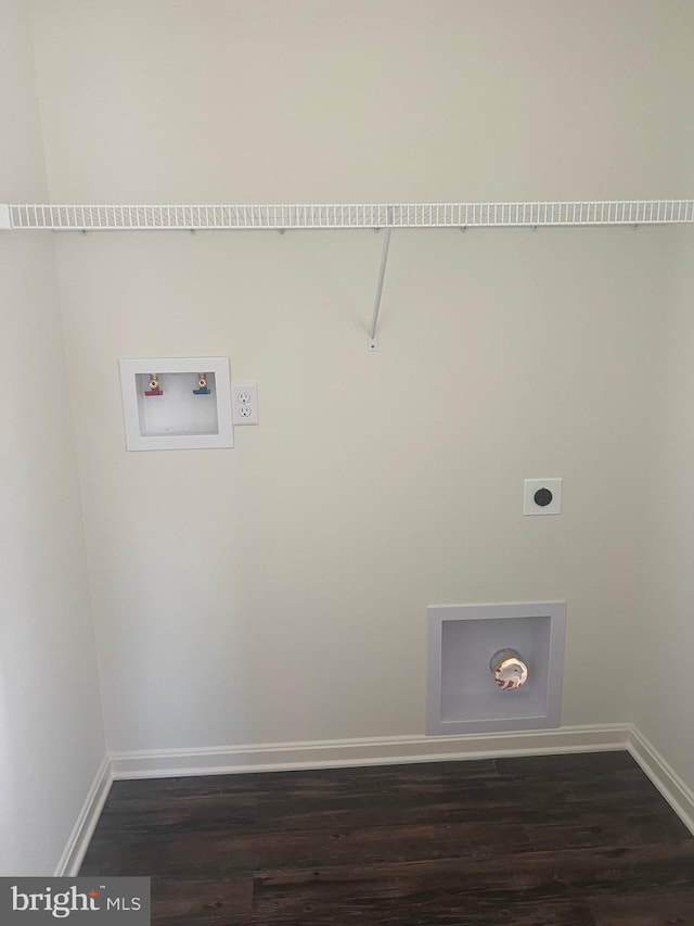 washroom with hookup for a washing machine, dark hardwood / wood-style floors, and hookup for an electric dryer