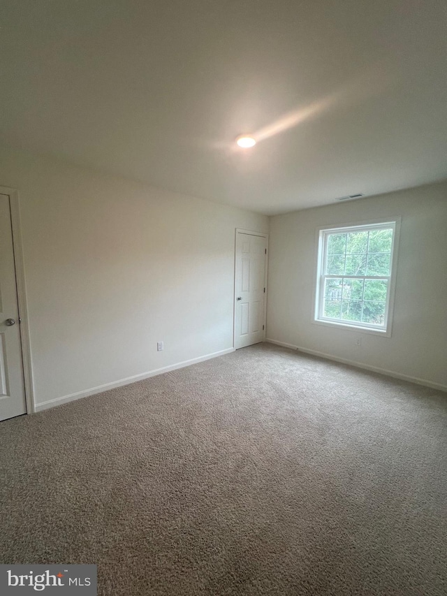 view of carpeted spare room