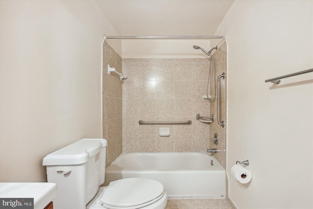 full bathroom featuring tile patterned floors, tiled shower / bath combo, toilet, and vanity