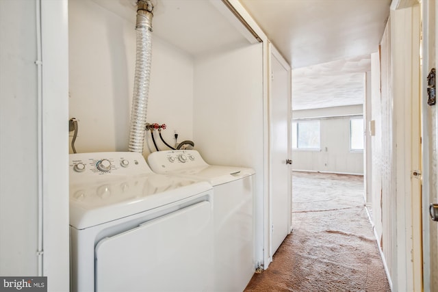 laundry area with carpet flooring and washing machine and dryer