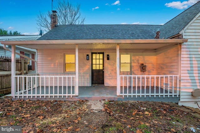 property entrance with covered porch