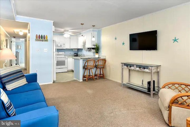 living room featuring light colored carpet, ceiling fan, and sink