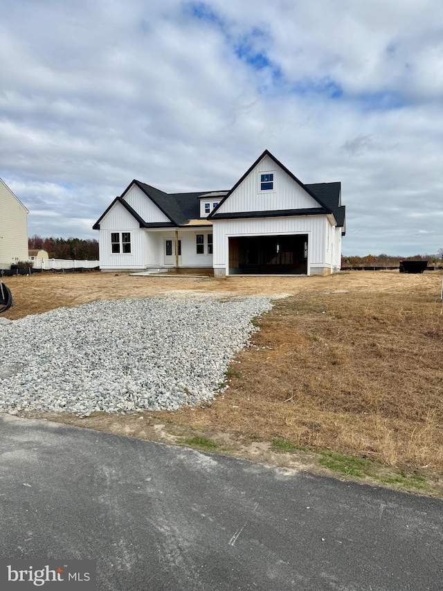 modern farmhouse style home with a garage