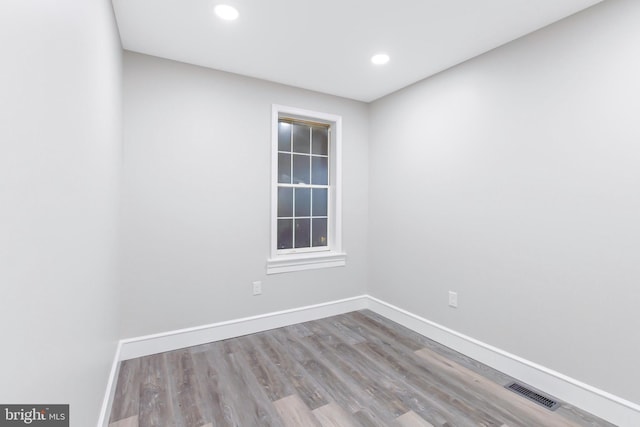 unfurnished room featuring light hardwood / wood-style flooring