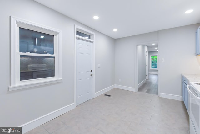 kitchen featuring white range oven