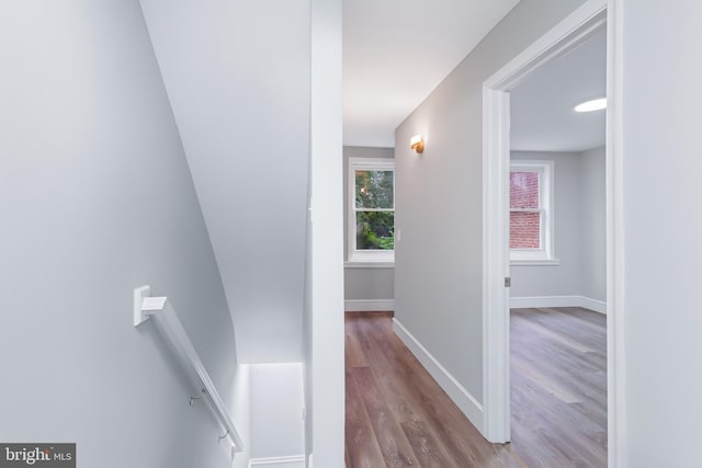 hallway with light hardwood / wood-style flooring