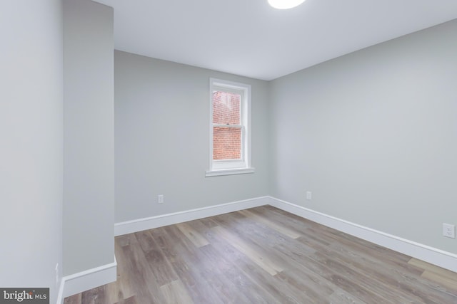 spare room with light wood-type flooring