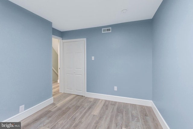 spare room with light hardwood / wood-style floors