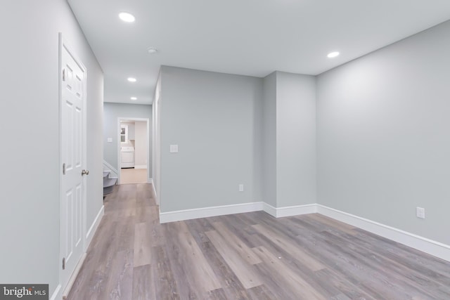 empty room with light hardwood / wood-style flooring