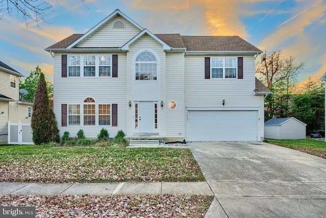 view of front facade featuring a yard and a garage