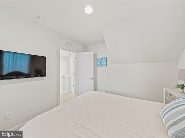 bedroom with vaulted ceiling