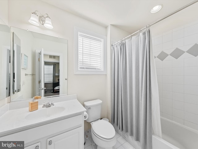 full bathroom with tile patterned floors, vanity, shower / bath combo, and toilet