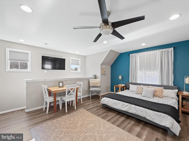 bedroom featuring hardwood / wood-style flooring and ceiling fan