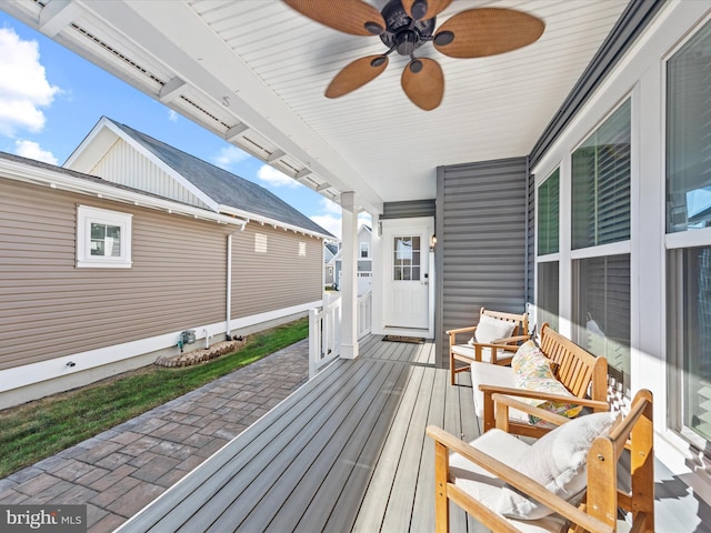 wooden terrace featuring ceiling fan