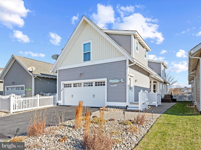 front of property featuring a garage and a front lawn