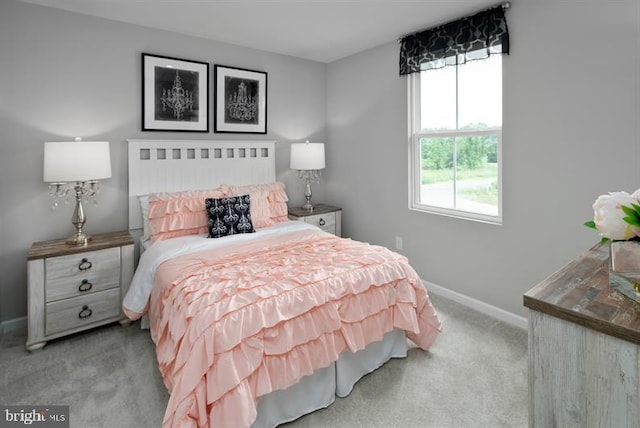 bedroom featuring light carpet