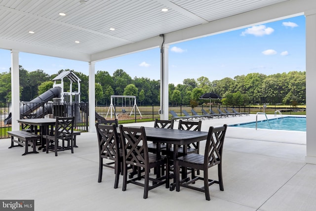 view of patio with a fenced in pool