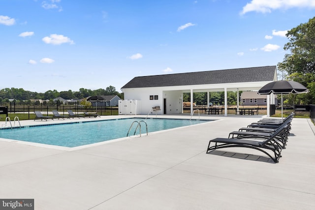 view of swimming pool with a patio