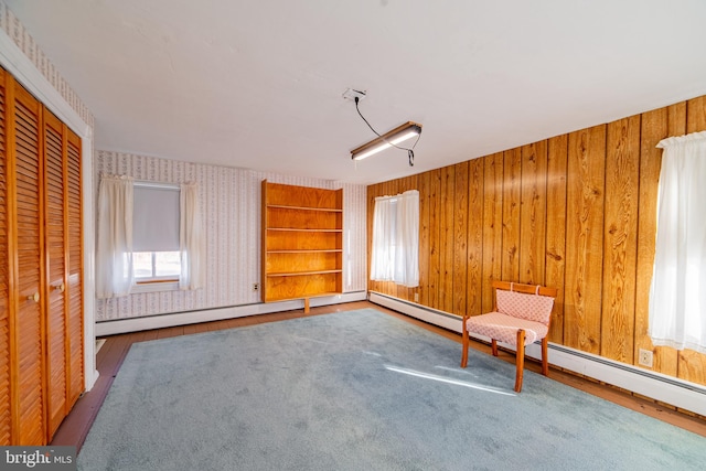 unfurnished room with built in shelves and wooden walls