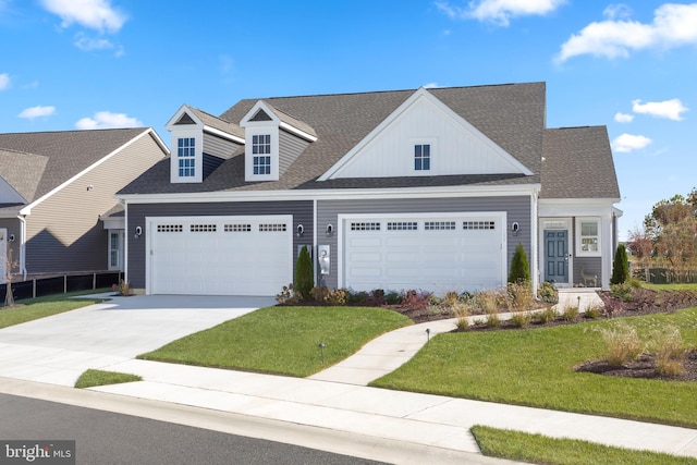 view of front of property featuring a garage and a front yard