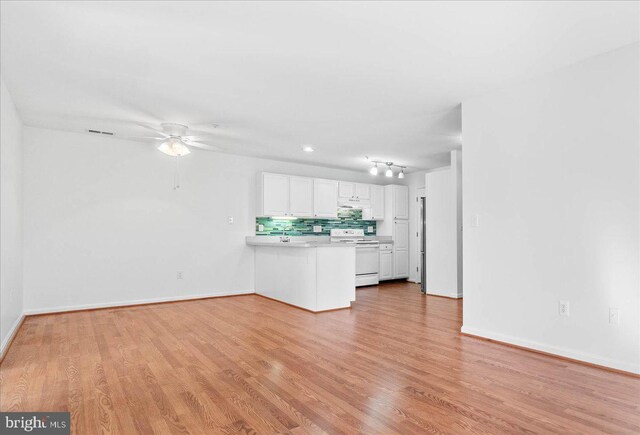 unfurnished living room with ceiling fan and light wood-type flooring