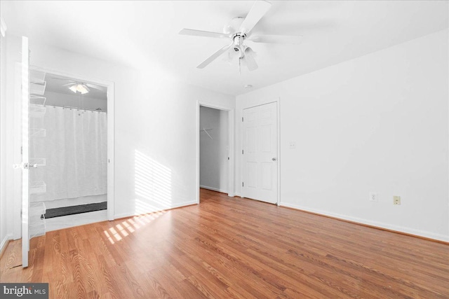 unfurnished room featuring ceiling fan and light wood-type flooring