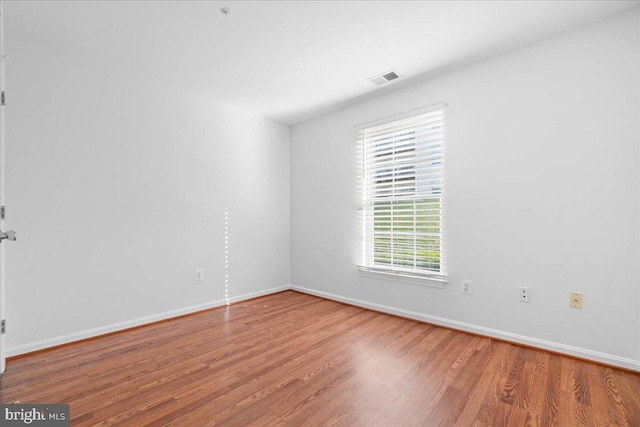 empty room featuring hardwood / wood-style flooring