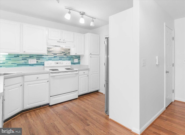 kitchen with electric stove, white cabinetry, light hardwood / wood-style flooring, and backsplash