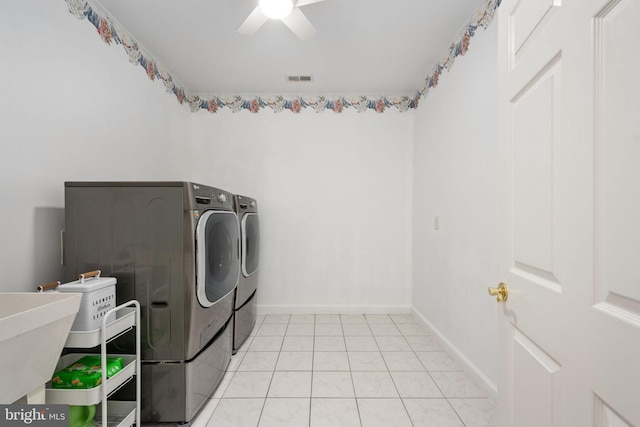 washroom with independent washer and dryer, light tile patterned floors, ceiling fan, and sink