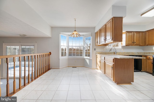 kitchen featuring a chandelier, light tile patterned floors, kitchen peninsula, and hanging light fixtures