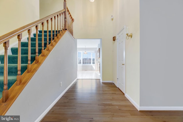 interior space with a chandelier and hardwood / wood-style flooring