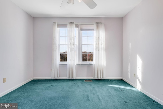 empty room with carpet and ceiling fan