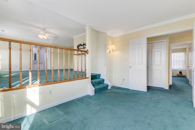 interior space featuring ceiling fan and crown molding