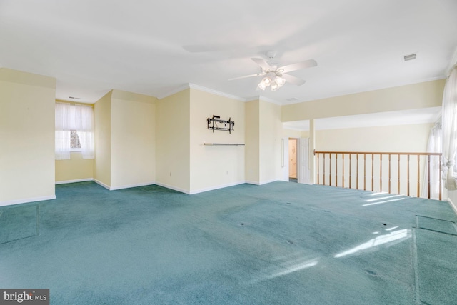 unfurnished room featuring crown molding, carpet, and ceiling fan