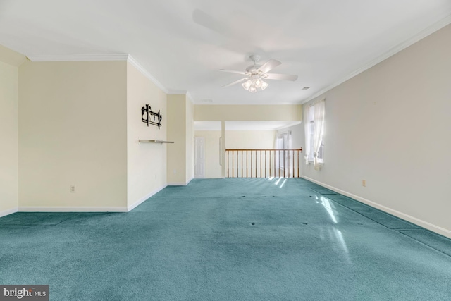 spare room featuring carpet flooring, ceiling fan, and ornamental molding