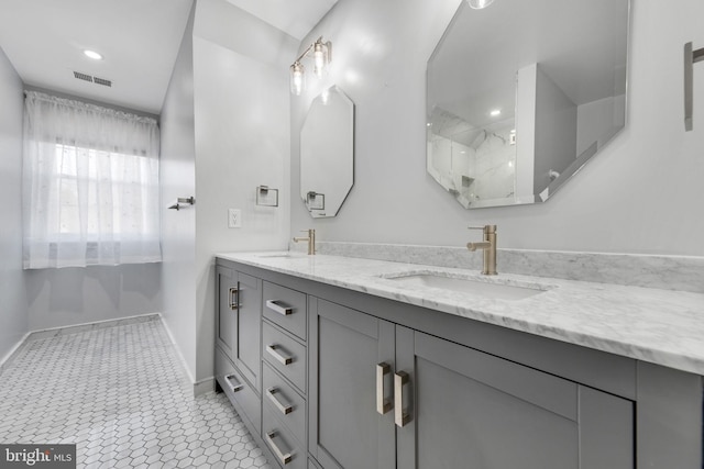 bathroom with tile patterned flooring and vanity