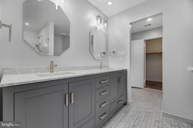 bathroom with vanity and tile patterned floors