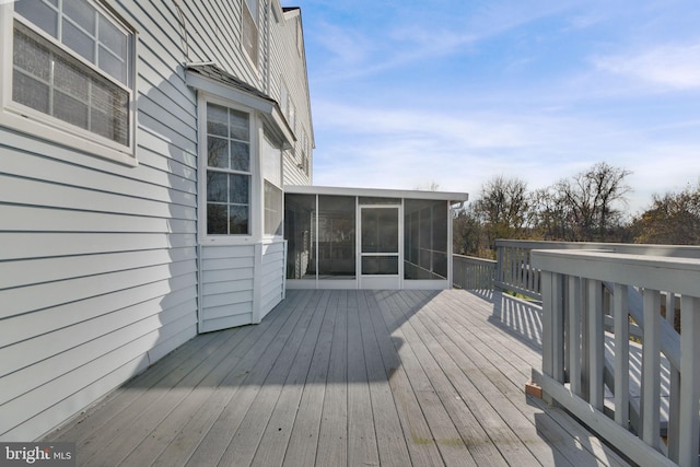 wooden terrace featuring a sunroom