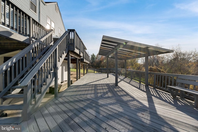 wooden deck with a pergola