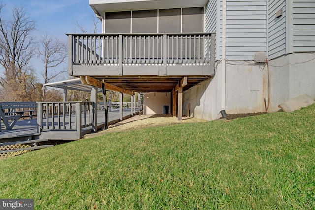 view of property exterior with a lawn and a wooden deck