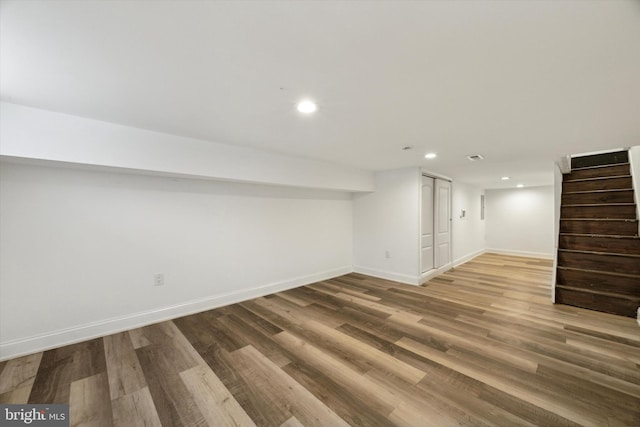 basement with hardwood / wood-style flooring