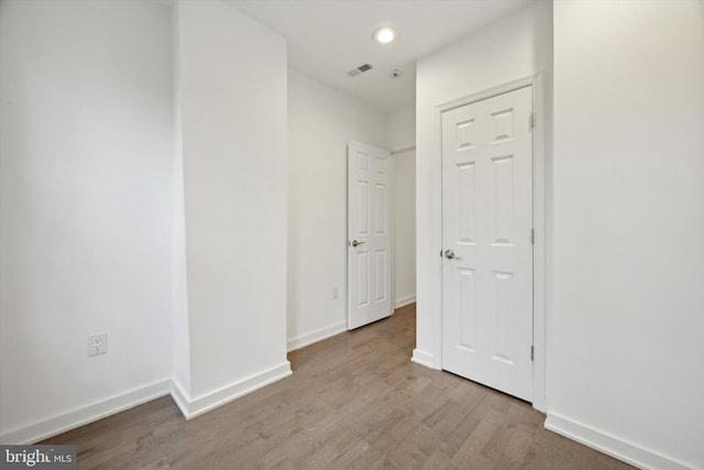 hall with light wood-type flooring