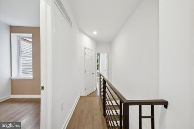 corridor featuring light hardwood / wood-style flooring