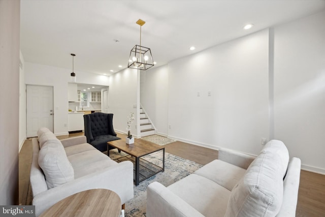 living room featuring hardwood / wood-style floors and a chandelier