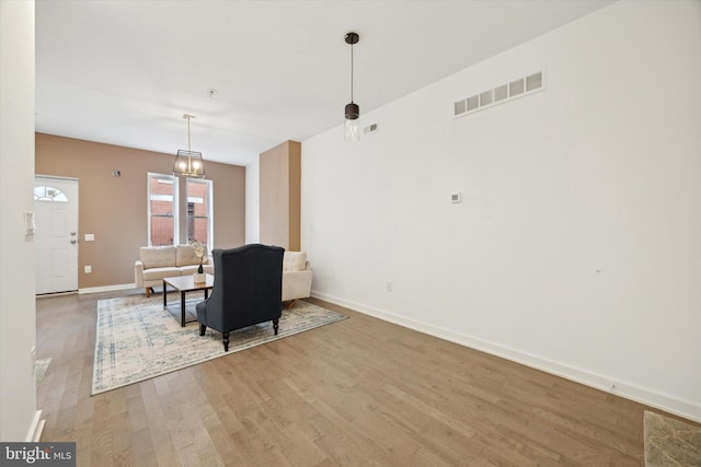 dining area with a chandelier and hardwood / wood-style flooring