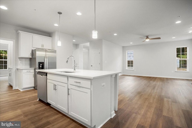 kitchen featuring white cabinetry, sink, a kitchen island with sink, and stainless steel appliances