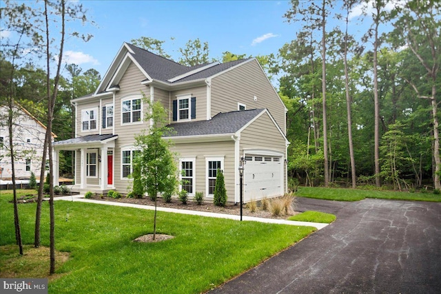 view of front facade featuring a garage and a front yard