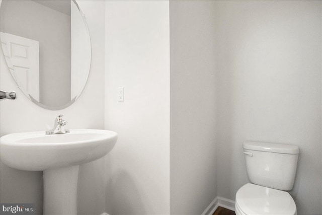 bathroom with sink and toilet