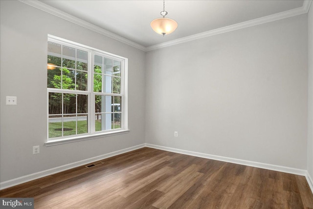 unfurnished room with hardwood / wood-style floors and ornamental molding